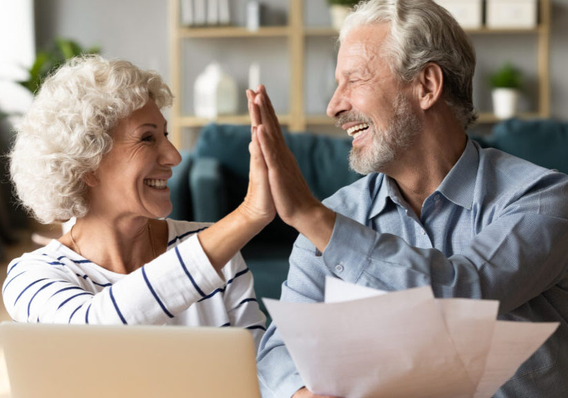 Excited,Older,Couple,Giving,High,Five,,Mature,Family,Celebrating,Success,